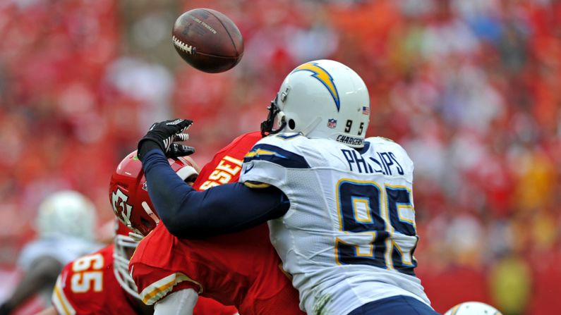 Shaun Phillips of the San Diego Chargers hits quarterback Matt Cassel of the Kansas City Chiefs, causing a fumble during the second quarter on Sunday.