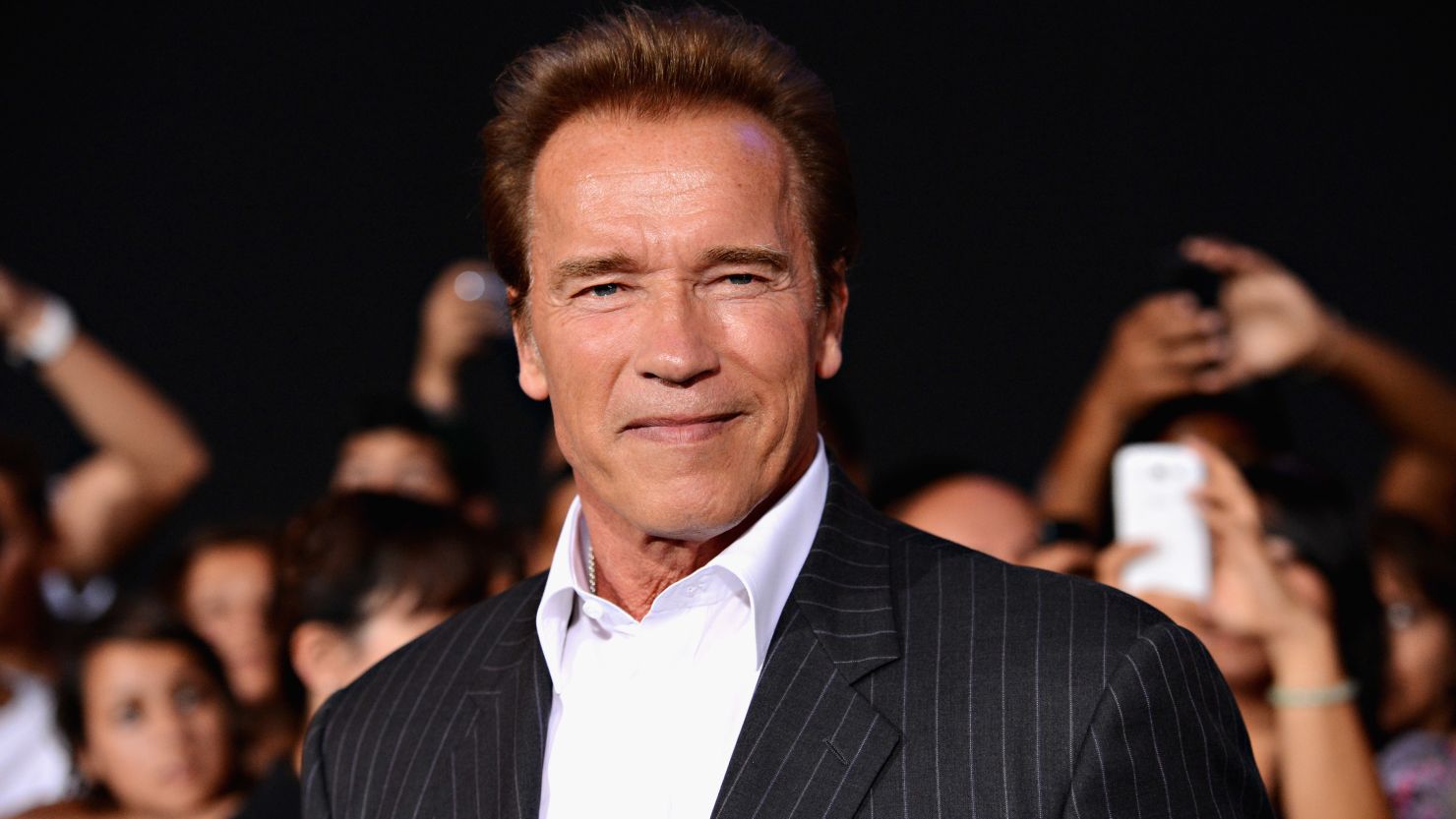 Arnold Schwarzenegger arrives at "The Expendables 2" premiere in August 2012.