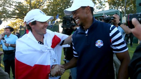 Rory McIlroy of Europe greets Tiger Woods on the 18th green after Europe defeated the United States 14.5 to 13.5 to retain the Ryder Cup.