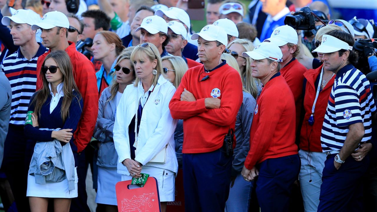 Davis Love III waits with some of his team on Sunday at the end of the singles matches.