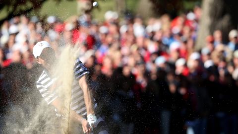 Keegan Bradley of the United States plays a bunker shot on the 14th hole on Sunday.