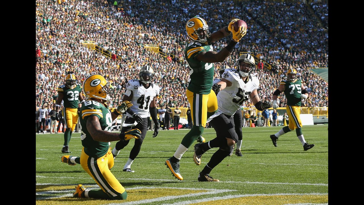 James Jones of the Green Bay Packers catches a pass for a touchdown Sunday against the New Orleans Saints at Lambeau Field in Green Bay, Wisconsin.