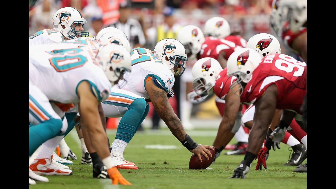 Mike Pouncey of the Miami Dolphins prepares to snap the football to quarterback Ryan Tannehill during Sunday's game against the Arizona Cardinals.