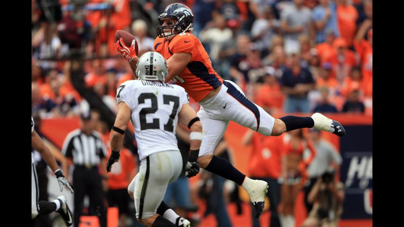Joel Dreessen of the Denver Broncos catches a 22-yard touchdown pass in the first quarter Sunday against the Oakland Raiders.