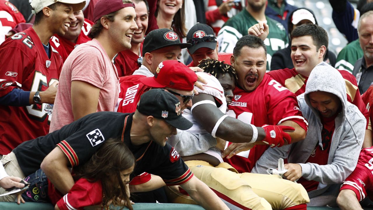 Anthony Dixon of the San Francisco 49ers celebrates with fans after a win over the New York Jets on Sunday.