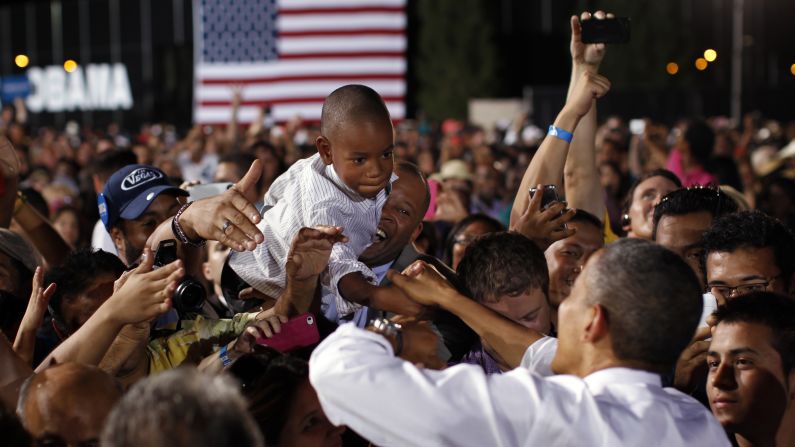 A boy reaches out to shake hands with Obama on Sunday in Las Vegas. The president was in Nevada ahead of Wednesday's presidential debate in Denver.