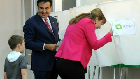 President Mikheil Saakashvili and his wife Sandra Roelofs cast their votes at a polling station in Tbilisi on October 1, 2012.