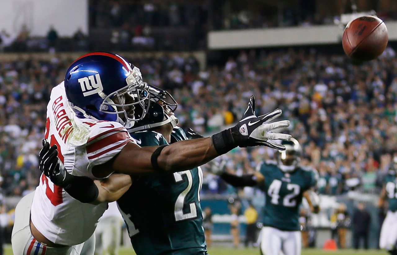 New York Giants wide receiver Ramses Barden, left, and Philadelphia Eagles cornerback Nnamdi Asomugha go up for the ball during the fourth quarter on Sunday, September 30, in Philadelphia. Barden was called for pass interference on the play during the Eagles' 19-17 win. 