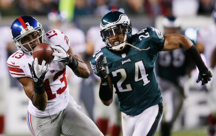 Giants wide receiver Ramses Barden catches a pass in front of Eagles cornerback Nnamdi Asomugha.
