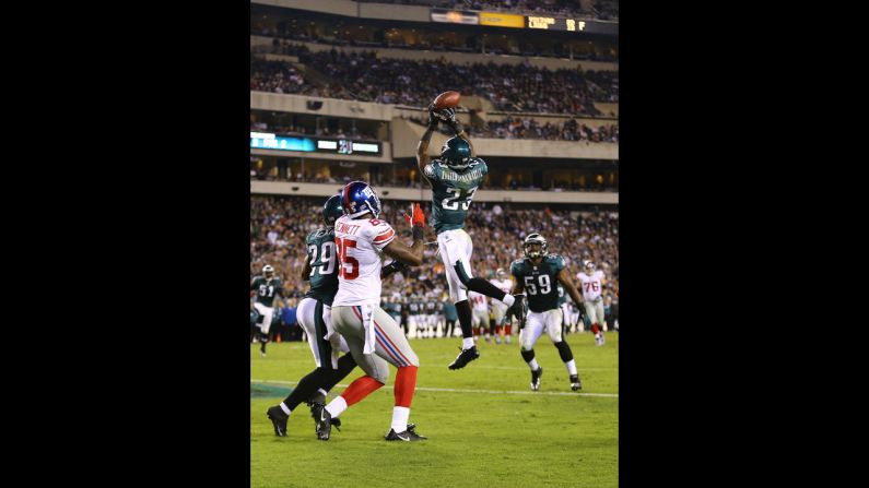 Dominique Rodgers-Cromartie of the Eagles intercepts a pass in the end zone thrown by Giants quarterback Eli Manning during Sunday's game.