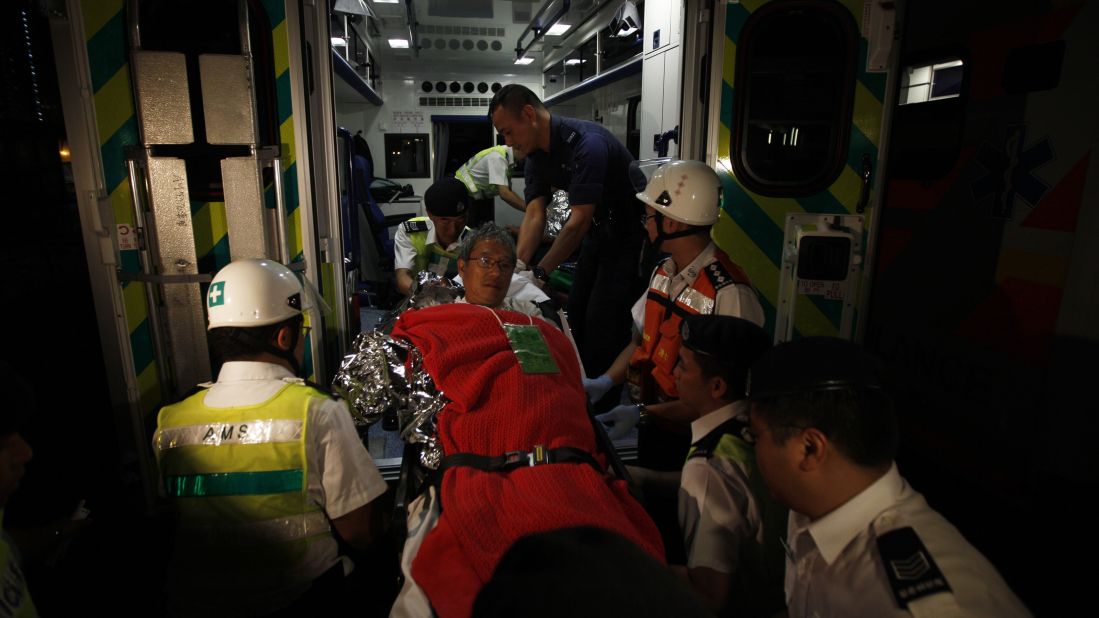 A survivor is helped onto an ambulance. The crash necessitated what local police called a "major rescue" operation, according to China's state-run media.