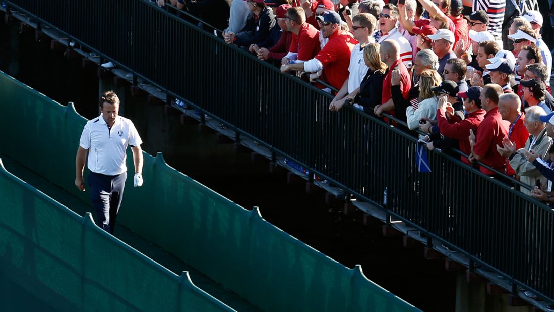 Graeme McDowell of Europe crosses a bridge during the singles matches on Sunday.