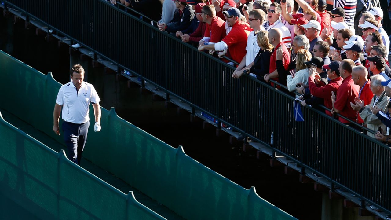 Graeme McDowell of Europe crosses a bridge during the singles matches on Sunday.