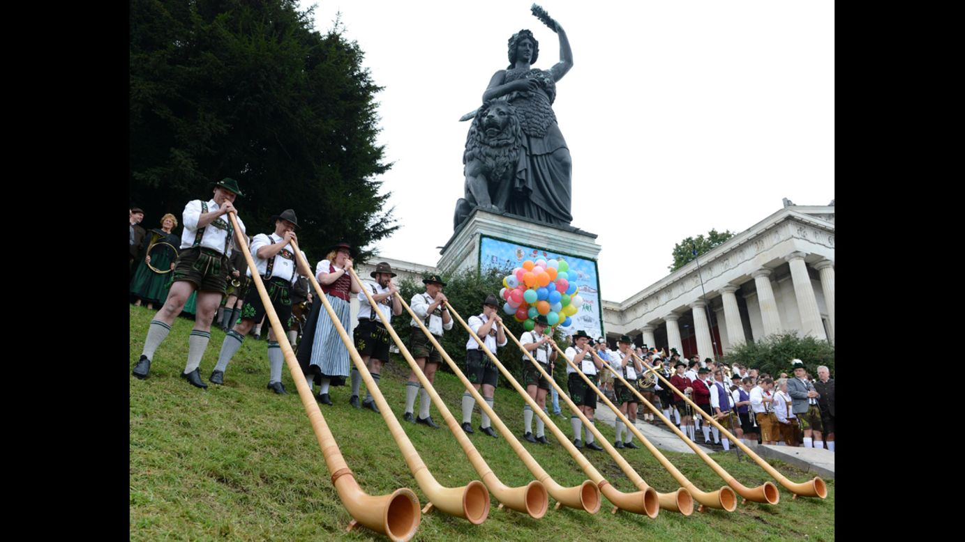 Alphorn musicians play at the foot of the Bavaria monument Sunday.