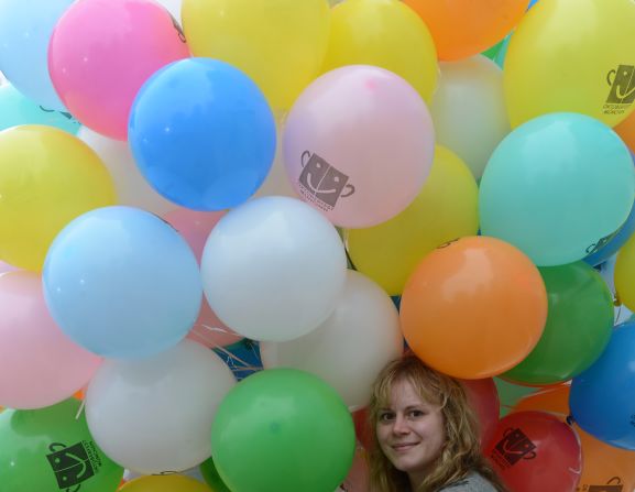 A girl holds balloons during Sunday's concert.
