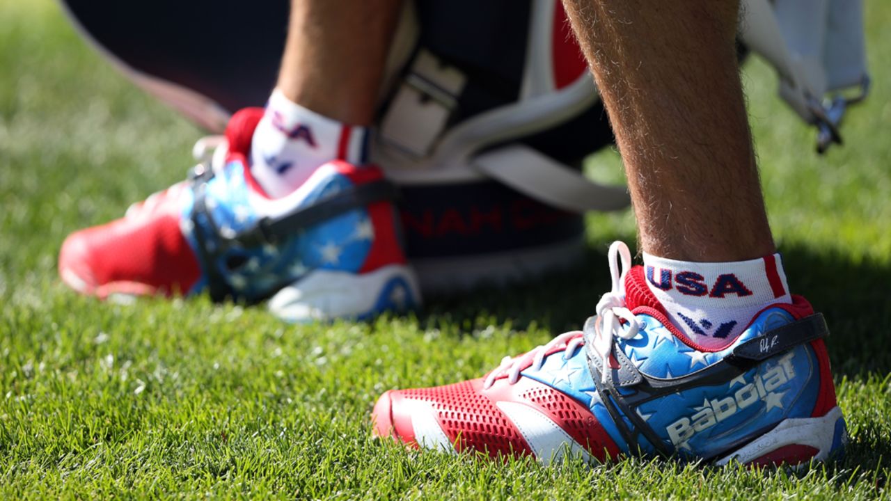 A U.S. team caddie wears patriotic shoes on Sunday.