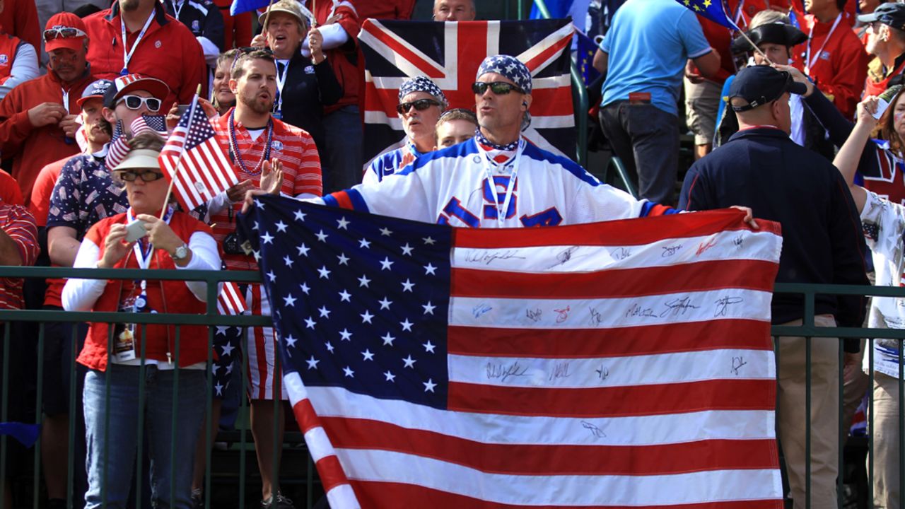Fans watch the play on the first tee during the singles matches of the Ryder Cup on Sunday.