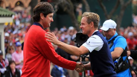 Bubba Watson of the United States, left, greets Luke Donald of Europe on the first tee Sunday in Medinah.