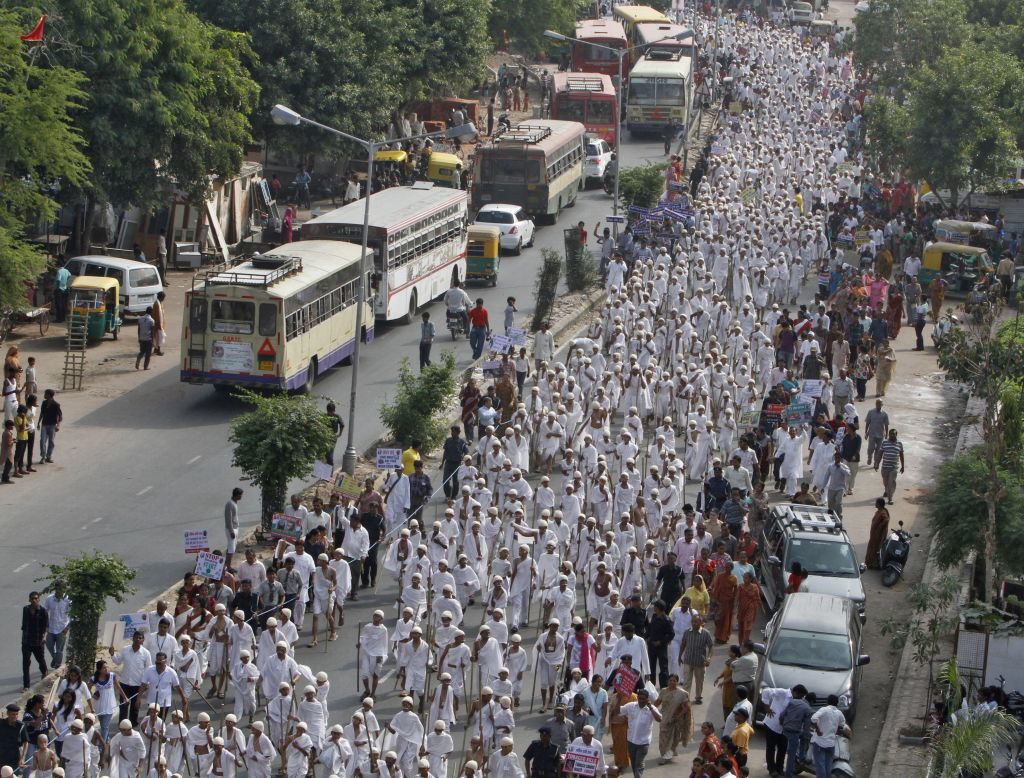 Schoolchildren march in their Gandhi attire on Tuesday.