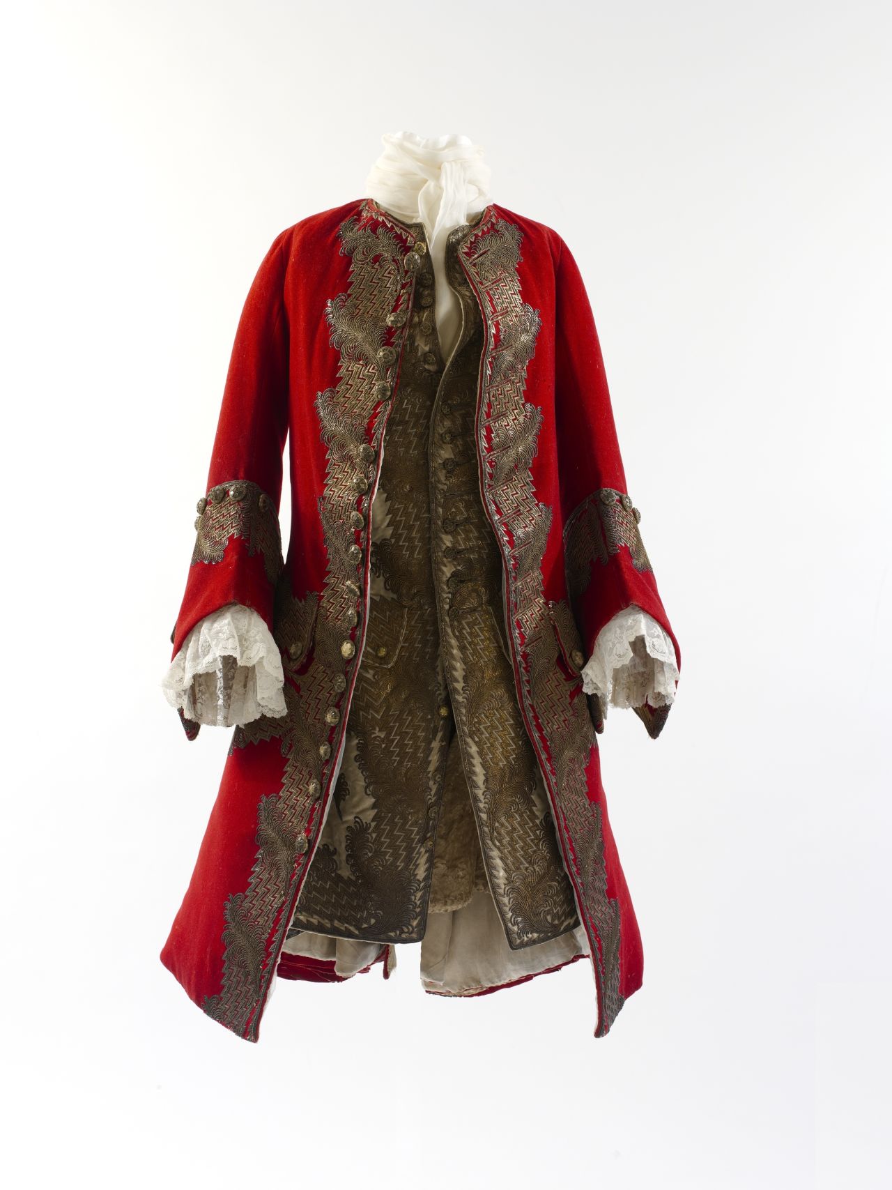 This wool broadcloth coat with gilt thread and sequin embroidery, and its matching waistcoa, are most likely British and hail from 1730. 