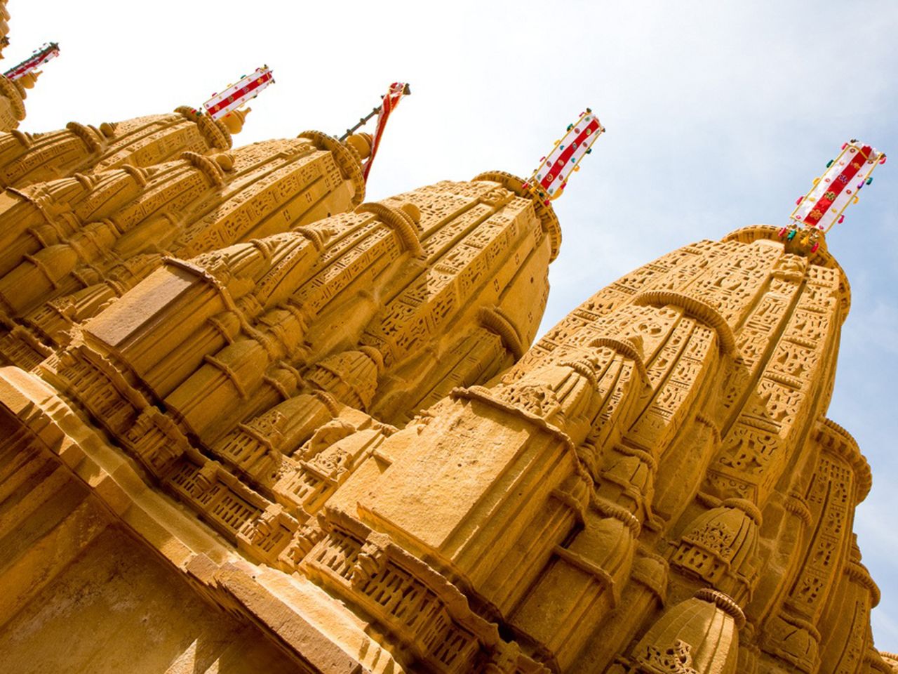 <strong>The Gold City:</strong> While Jaipur and Jodphur have multiple buildings sporting their signature shades, Jaisalmer has just one. Established in 1156, the city gets its nickname from the magnificent Jaisalmer Fort, which appears to lord over the city from a hilltop perch.