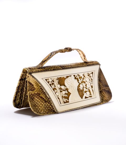 This German-designed snakeskin handbag from the 1920s features an ivory "cover sheet" depicting the biblical Eve with the proverbial apple. 