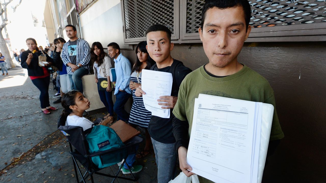 Immigrants who came to the U.S. as children line up in August to file deferral applications at an office in Los Angeles.