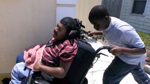 Terrell Termidor, 13, has to help care for his paralyzed brother, Emanuel, while their single mother works a full-time job.