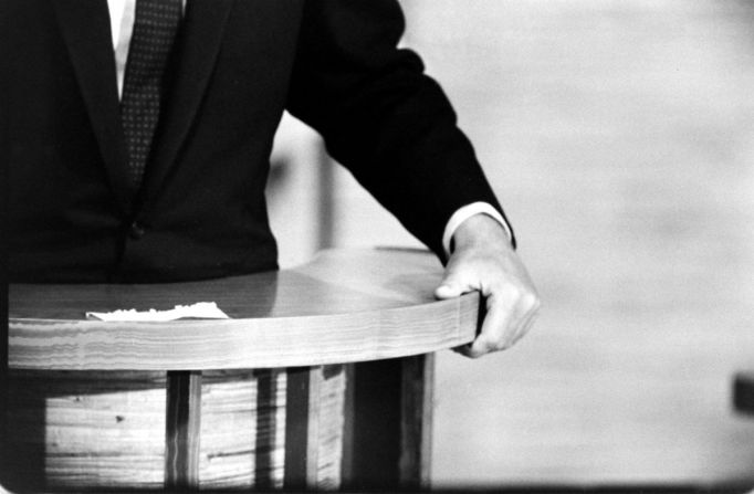 A closeup shows Kennedy's hand during the debates.