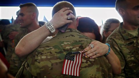 Back from Afghanistan, troops from the Indiana Army National Guard are greeted by family and friends on September 26.
