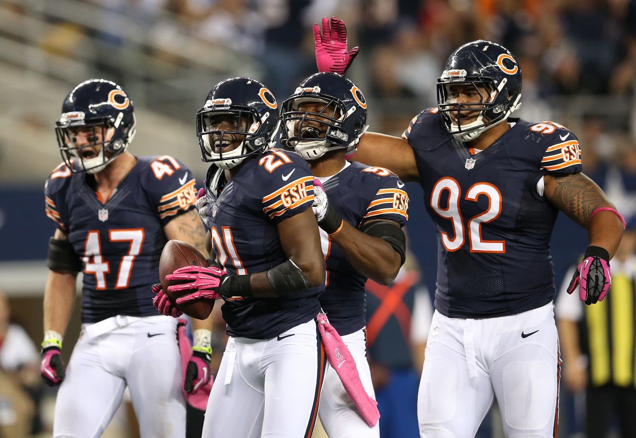 The Bears' Major Wright, No. 21, reacts after he intercepted a pass in the third quarter on Monday.
