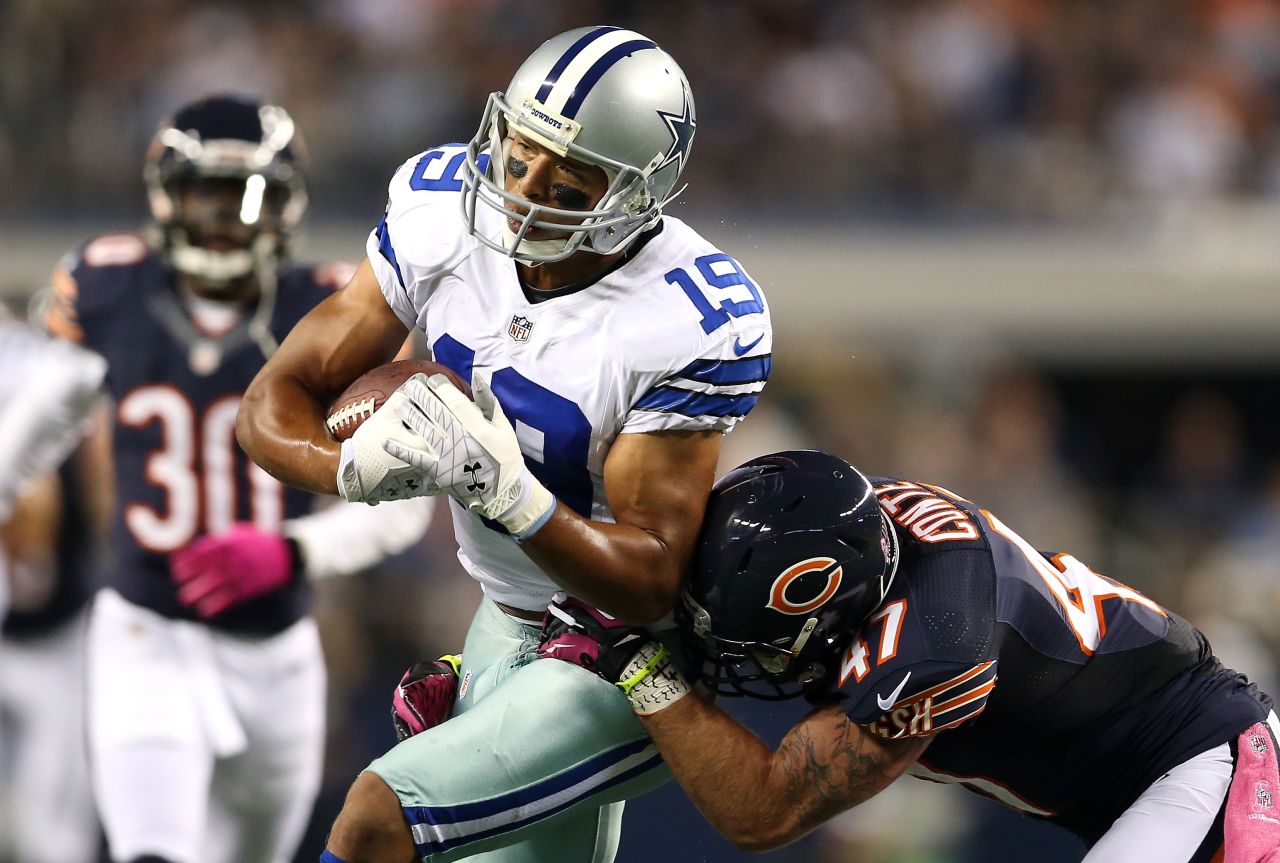 The Cowboys' Miles Austin catches a pass in the first half Monday against Chris Conte.