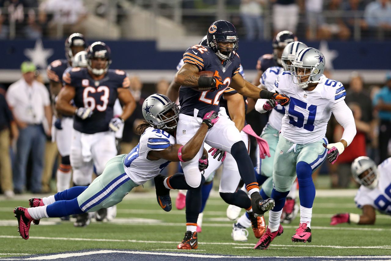 The Bears' Matt Forte runs the ball in the second quarter of Monday's game against the Cowboys' No. 40, Danny McCray.