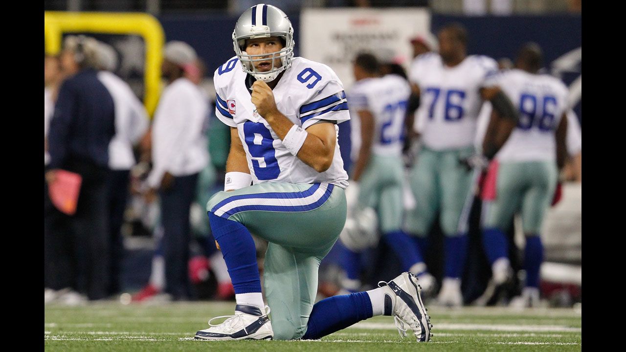 Cowboys quarterback Tony Romo reacts after throwing an interception on Monday.