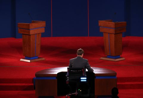 University of Denver student Sam Garry sits at the moderator's desk before a presidential debate dress rehearsal at the University of Denver on Tuesday, October 2. 