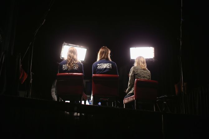 Volunteers sit in for on-air television reporters on Tuesday in preparation for the first presidential debate in the Ritchie Center at the University of Denver.