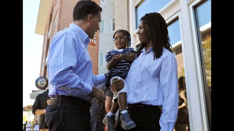 Romney greets a father and his daughter after having lunch Tuesday at a restaurant in Denver.