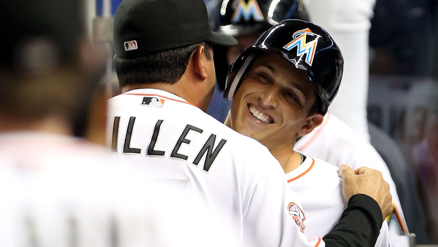 Adam Greenberg hugs Miami Marlins manager Ozzie Guillen after his at-bat Tuesday night against the New York Mets.