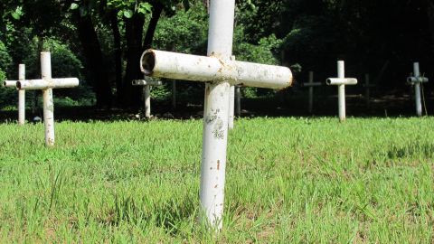 Metal pipe crosses mark the graves at a makeshift cemetery on the grounds of a former reform school for boys in Florida.