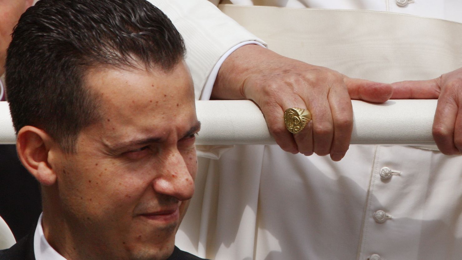 Pope Benedict XVI's former butler Paolo Gabriele pictured sitting below the pontiff on June 6, 2007.