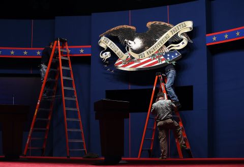 Workers make adjustments to the stage on Tuesday. 