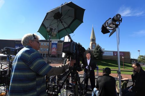 Television crews begin to broadcast on Tuesday outside the Ritchie Center, where the first 2012 presidential debate will take place.