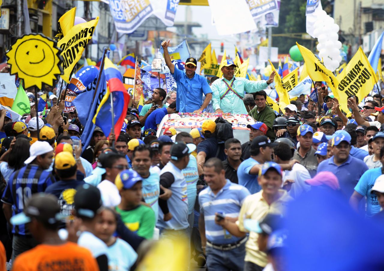 Capriles greets supporters during a campaign rally in Puerto Ayacucho on Monday.
