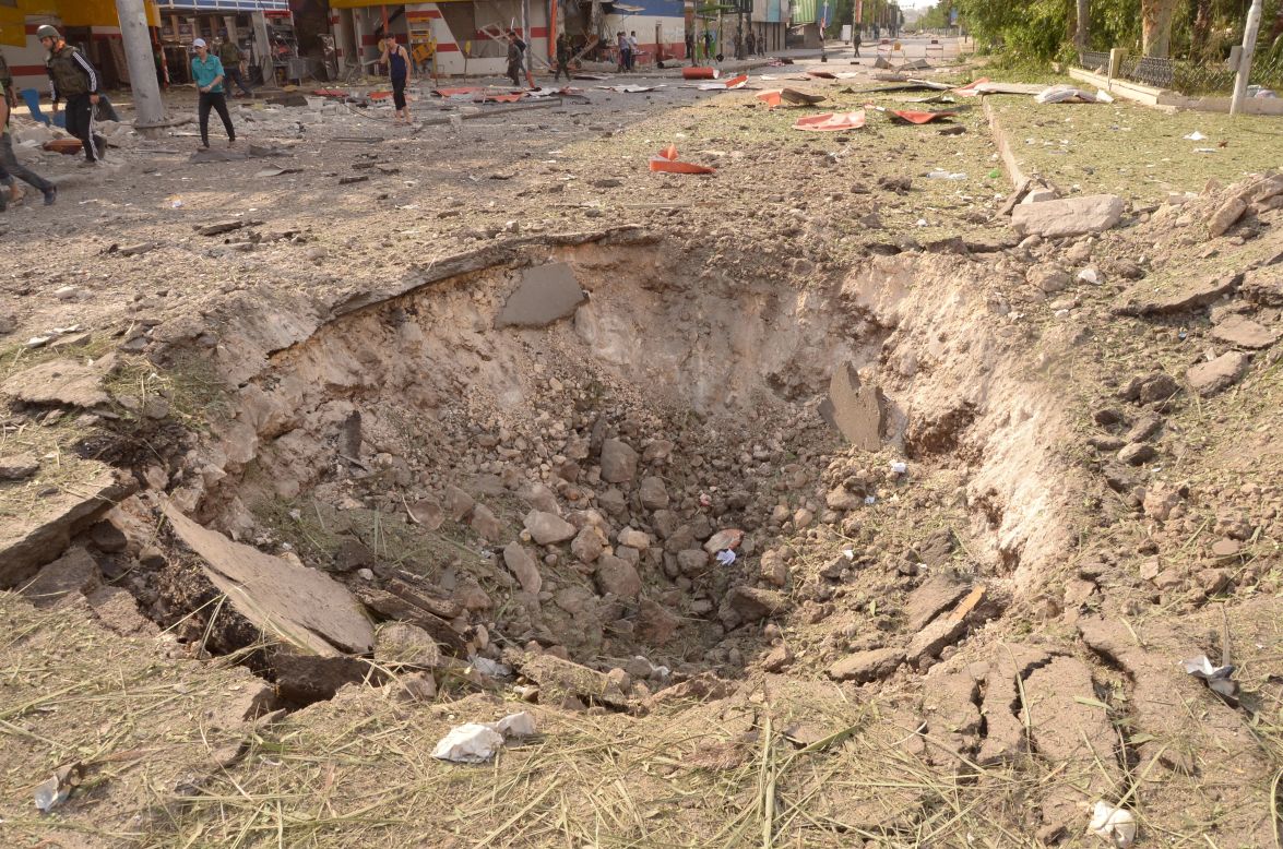 Car bomb explosions in Aleppo on Wednesday left a crater in the ground.