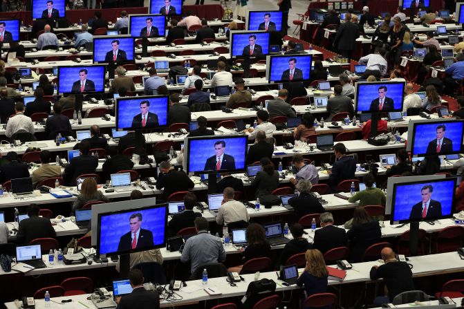 Reporters watch the final minutes of the debate between Romney and Obama in Denver on Wednesday, October 3. The first of four debates for the 2012 election -- three presidential and one vice-presidential -- was moderated by Jim Lehrer of PBS.