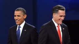 US President Barack Obama (L) and Republican presidential candidate Mitt Romney finish their debate at the University of Denver in Denver, Colorado, October 3, 2012. After hundreds of campaign stops, $500 million in mostly negative ads and countless tit-for-tat attacks, Obama and Romney go head-to-head in their debut debate. AFP PHOTO / Saul LOEB (Photo credit should read 