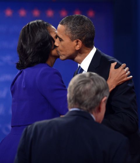 President Obama kisses first lady Michelle Obama after the debate Wednesday. It took place on their 20th wedding anniversary.