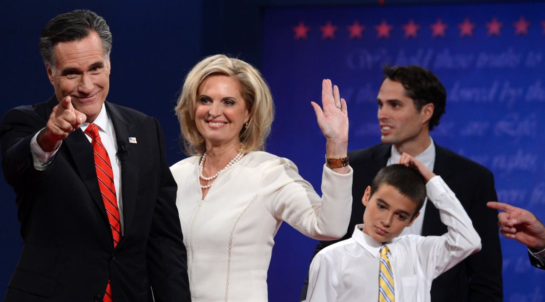 Romney stands with his wife, Ann, and family following the first presidential debate.