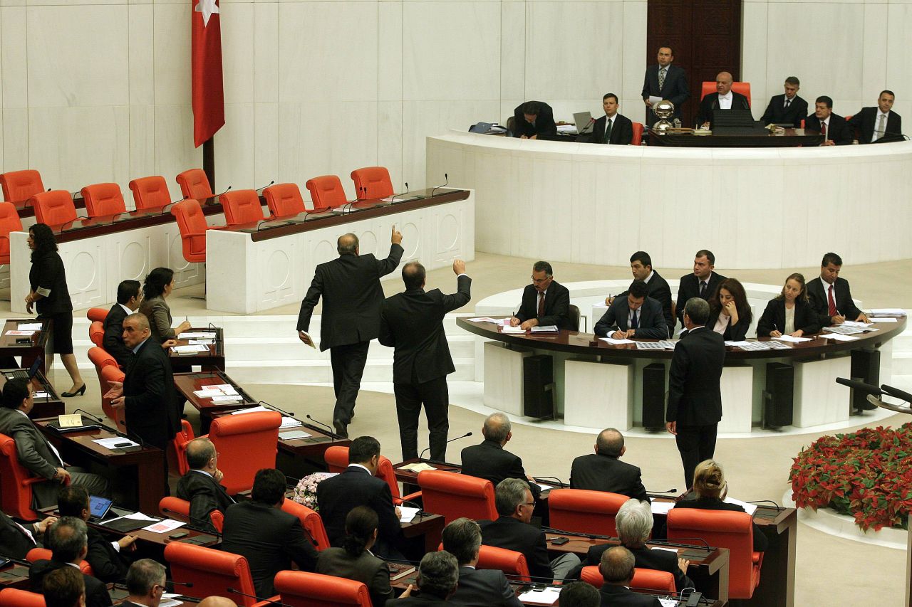 Members of parliament attend an emergency session to discuss a bill authorizing the Turkish military to launch cross-border operations in Ankara on Thursday.