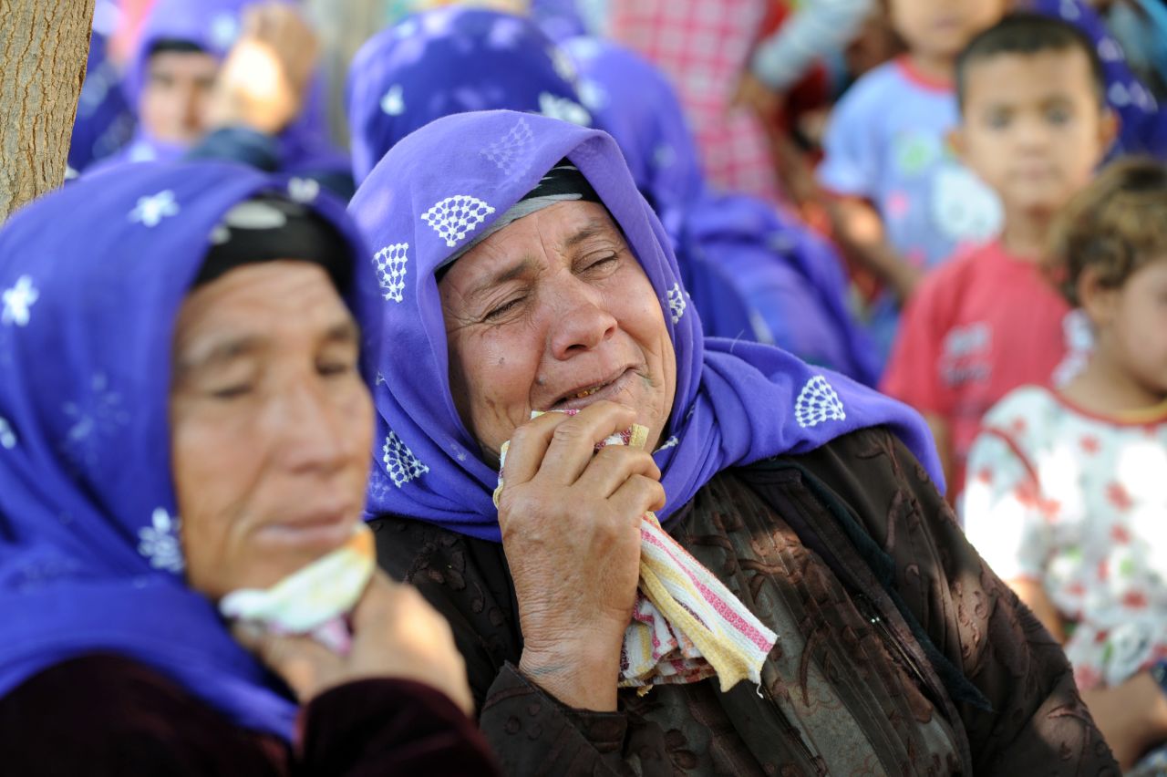 Local women mourn victims of the Syrian mortar attack on Thursday.